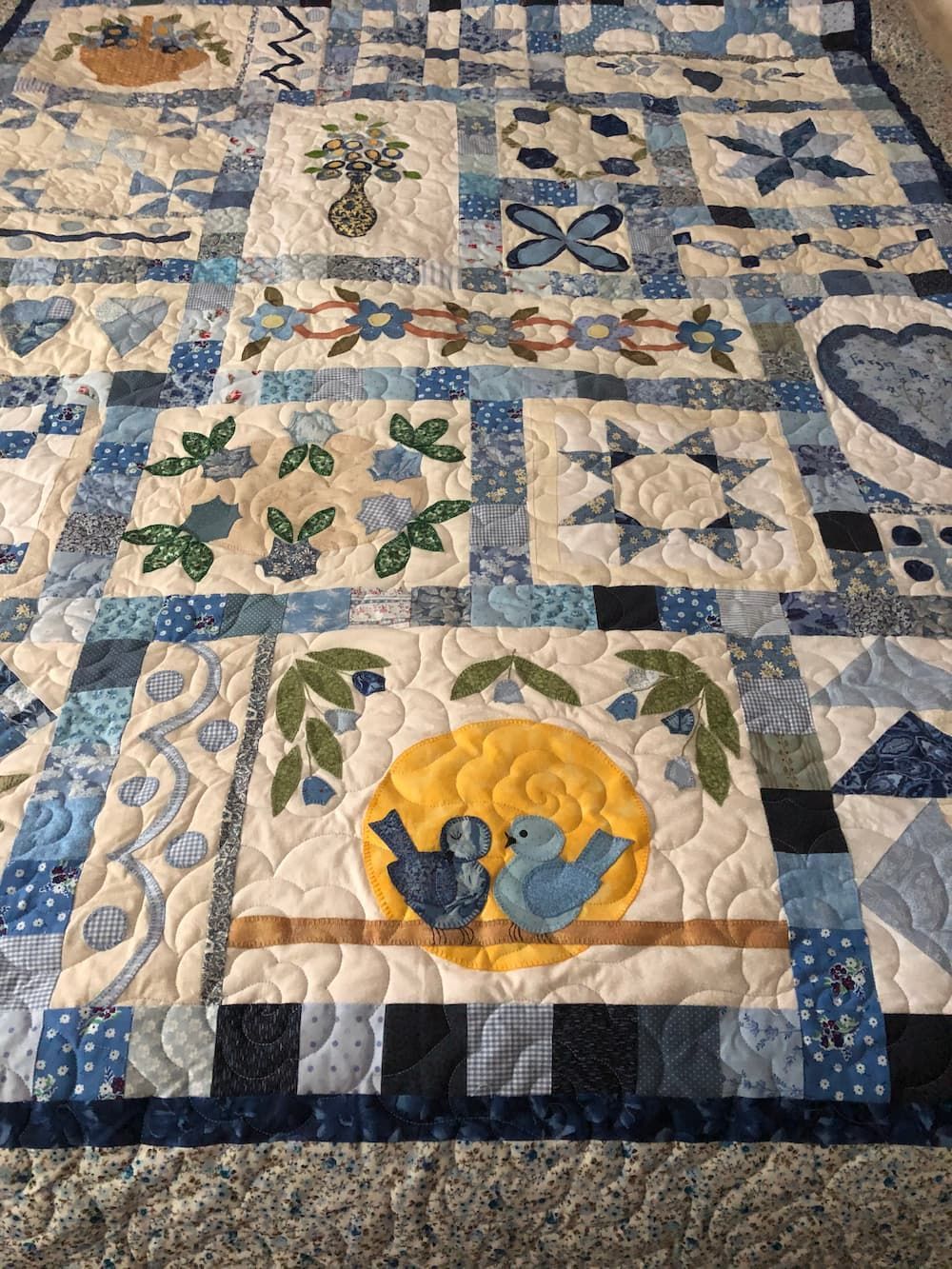 Blue and White Quilt With Various Patterned Squares — Morning Star Quilting in Bateau Bay, NSW