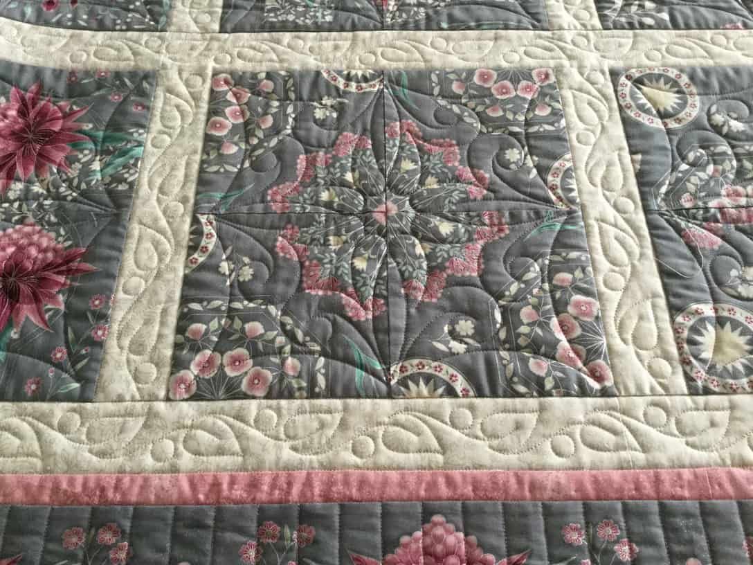 Close-up of a Floral Patchwork Quilt — Morning Star Quilting in Bateau Bay, NSW