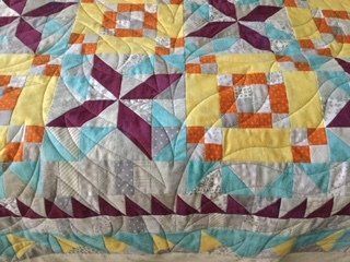 Quilted Textile in Teal, Purple, Yellow, and Orange Geometric Patterns — Morning Star Quilting in Bateau Bay, NSW