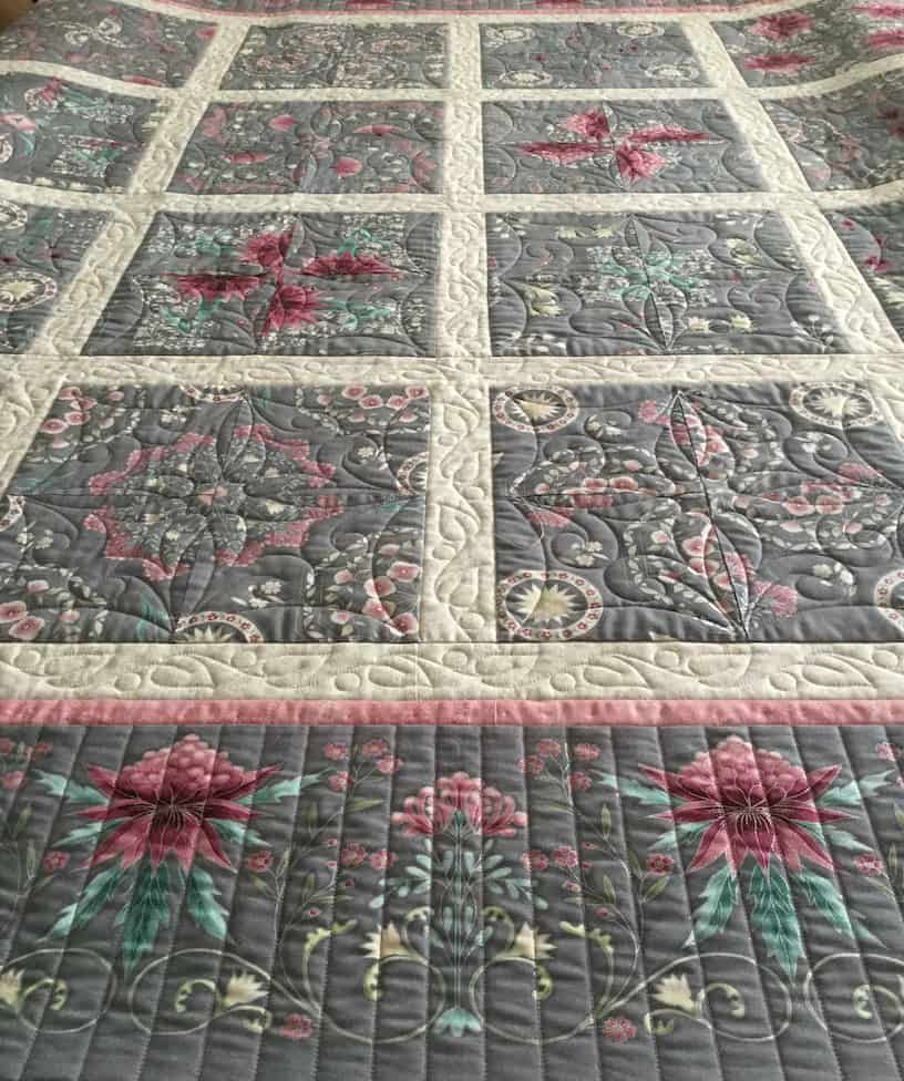 Quilted Bedspread With Gray Floral Patterns, Light Cream Framing, and Pink Border — Morning Star Quilting in Bateau Bay, NSW