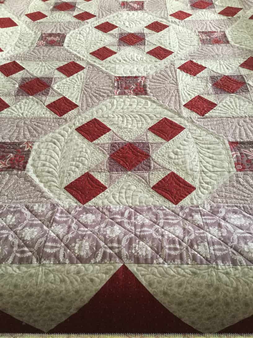 Quilt With Repeating Diamond and Square Patterns in Red and White — Morning Star Quilting in Bateau Bay, NSW
