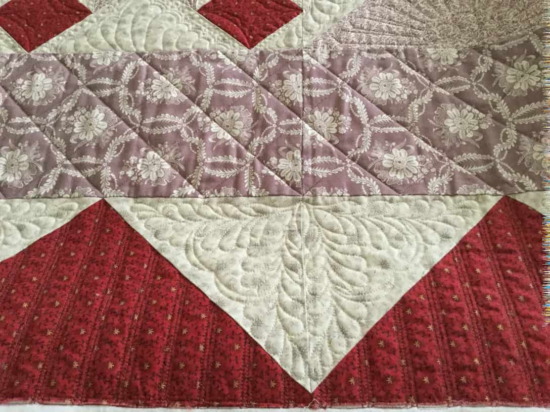 Close-up of a Quilted Textile With Red, White, and Purple Geometric Patterns — Morning Star Quilting in Bateau Bay, NSW