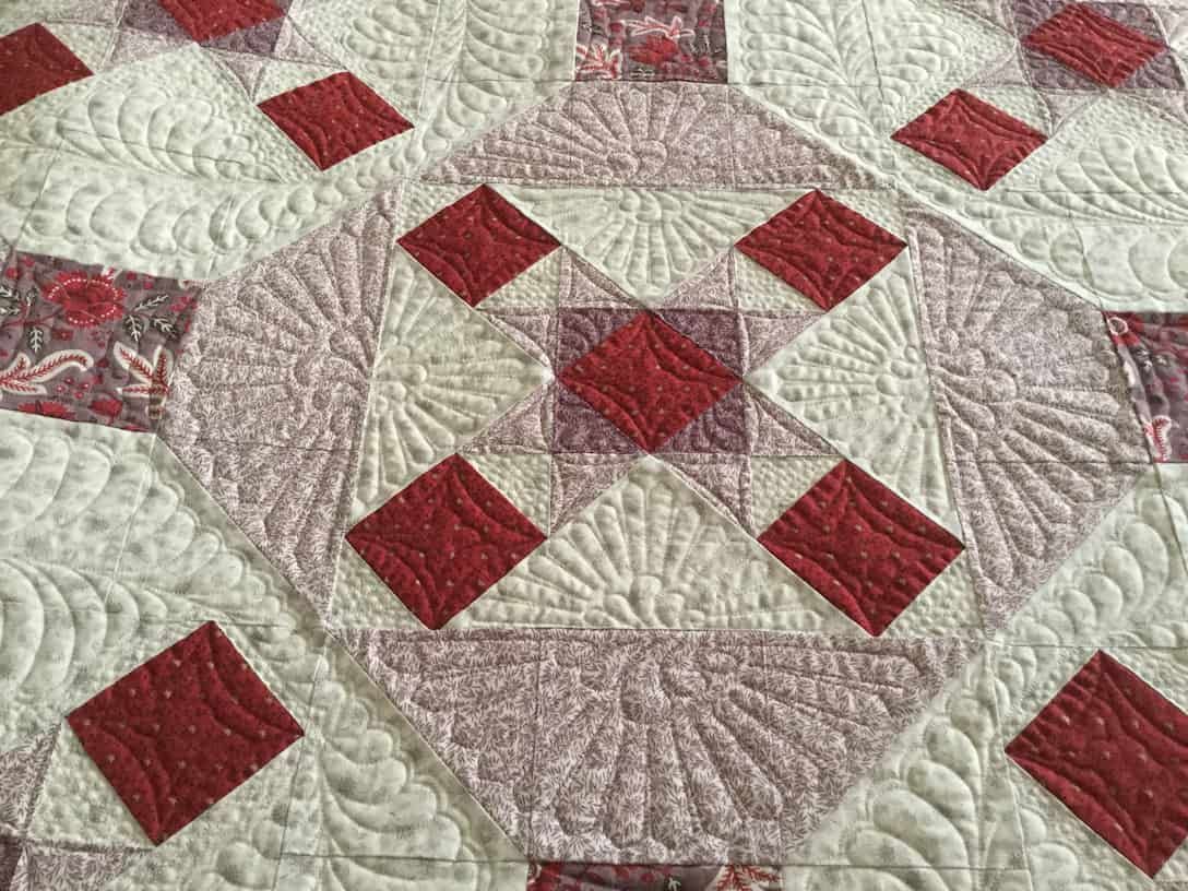 Quilted Fabric With Red Diamond Pattern on a Light Background — Morning Star Quilting in Bateau Bay, NSW