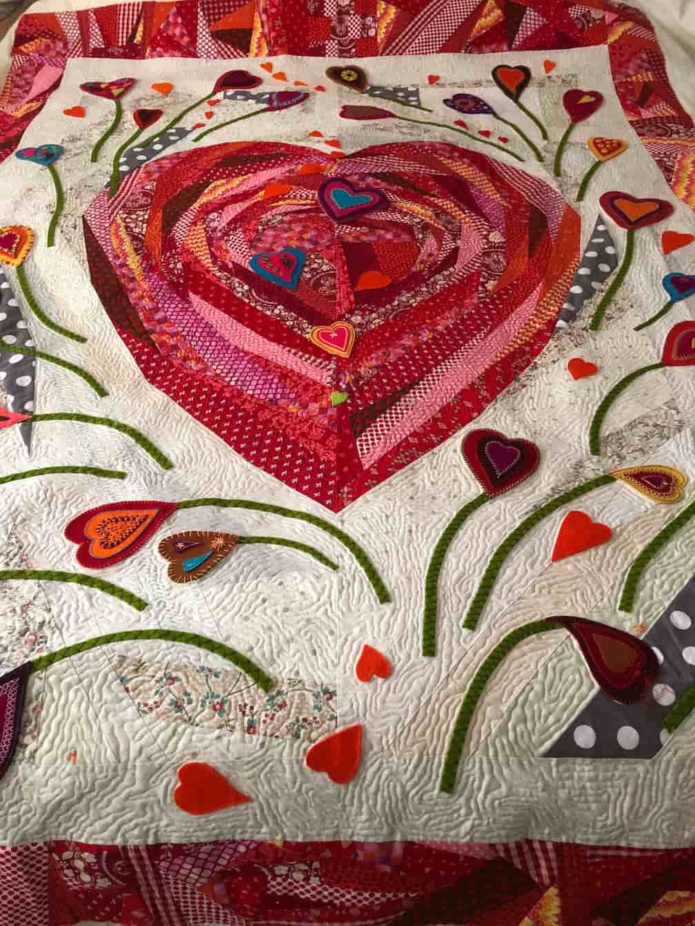 Quilted Heart-shaped Design in Red, Pink, and Orange — Morning Star Quilting in Bateau Bay, NSW