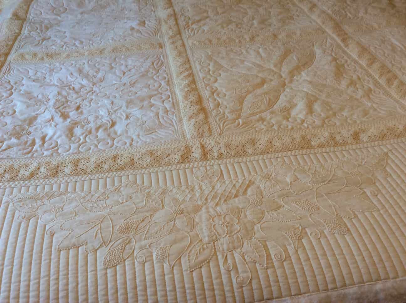Cream-coloured Quilted Bedspread With Floral and Geometric Patterns — Morning Star Quilting in Bateau Bay, NSW