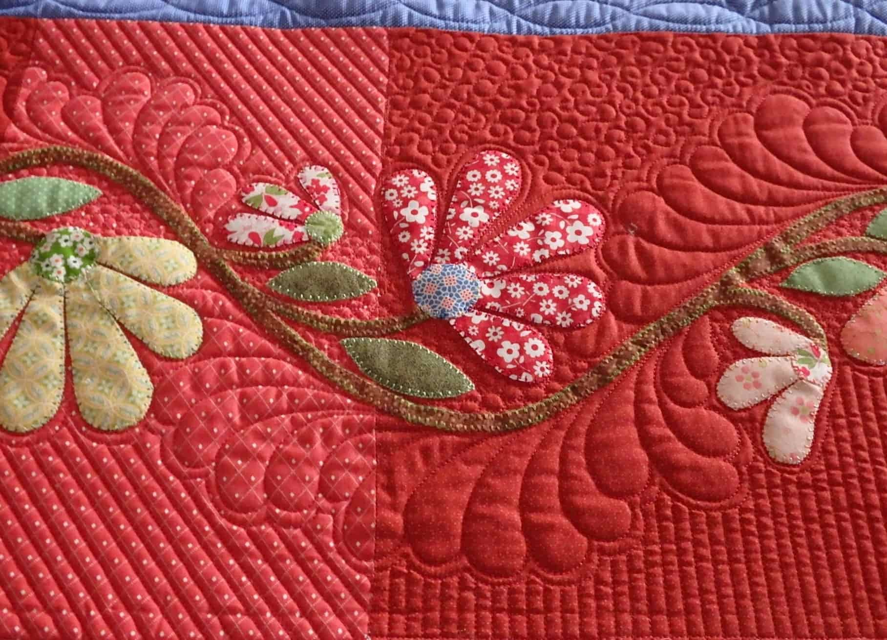 Red Quilt With Applique Floral Design; Varying Quilting Patterns — Morning Star Quilting in Bateau Bay, NSW