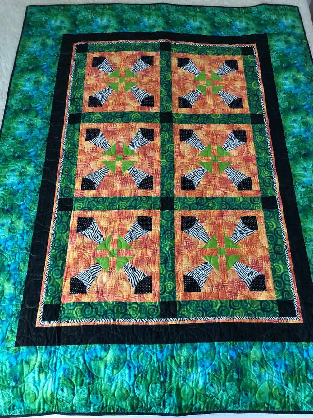 Quilt With Green, Orange, and Black Blocks Featuring Zebra Print — Morning Star Quilting in Bateau Bay, NSW