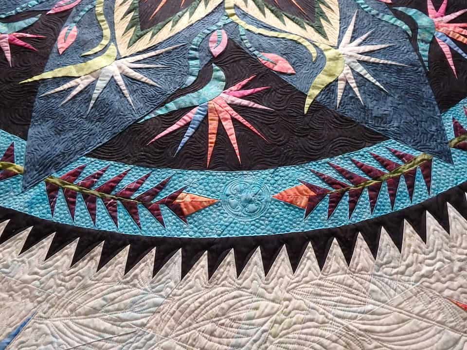 Close-up of a Colourful Quilt With Geometric and Plant-like Designs in Blue — Morning Star Quilting in Bateau Bay, NSW