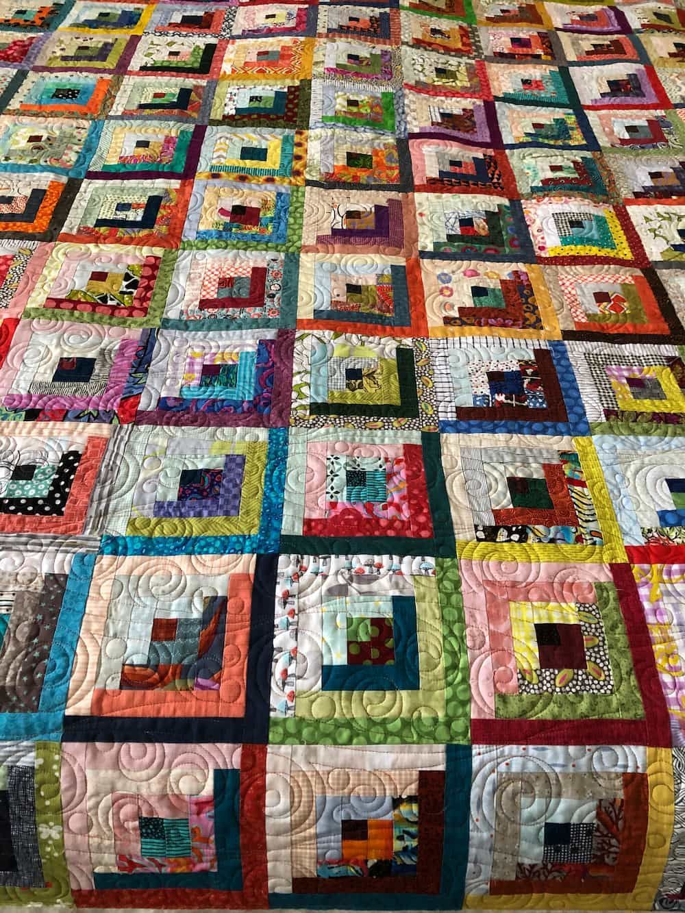 Colourful Quilt With Log Cabin Blocks, Various Fabrics, and Quilted Patterns — Morning Star Quilting in Bateau Bay, NSW