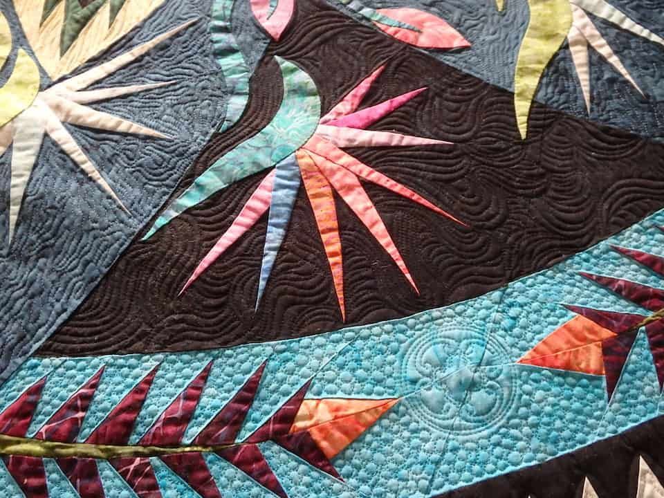 Close-up of a Quilt With Turquoise, Black, and Orange Geometric — Morning Star Quilting in Bateau Bay, NSW