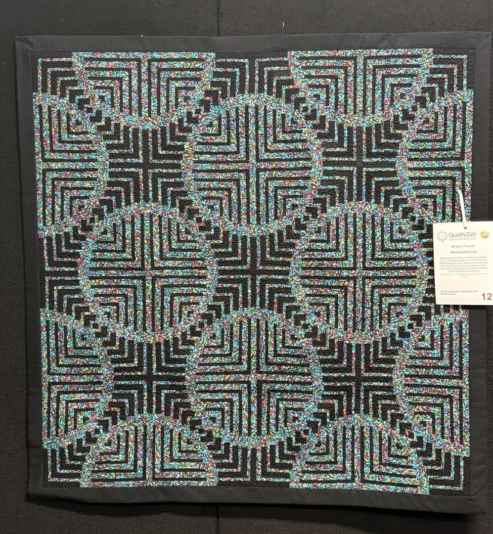 Quilt with turquoise and black geometric pattern of squares and circles — Morning Star Quilting in Bateau Bay, NSW