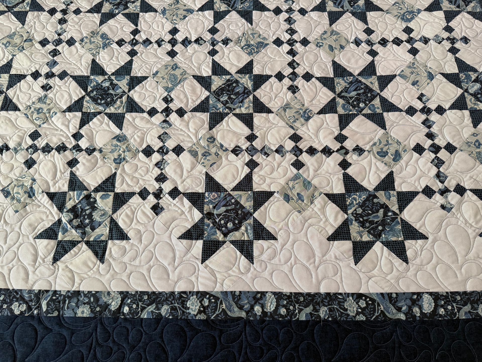 Blue and white quilt with star patterns and intricate quilting designs — Morning Star Quilting in Bateau Bay, NSW