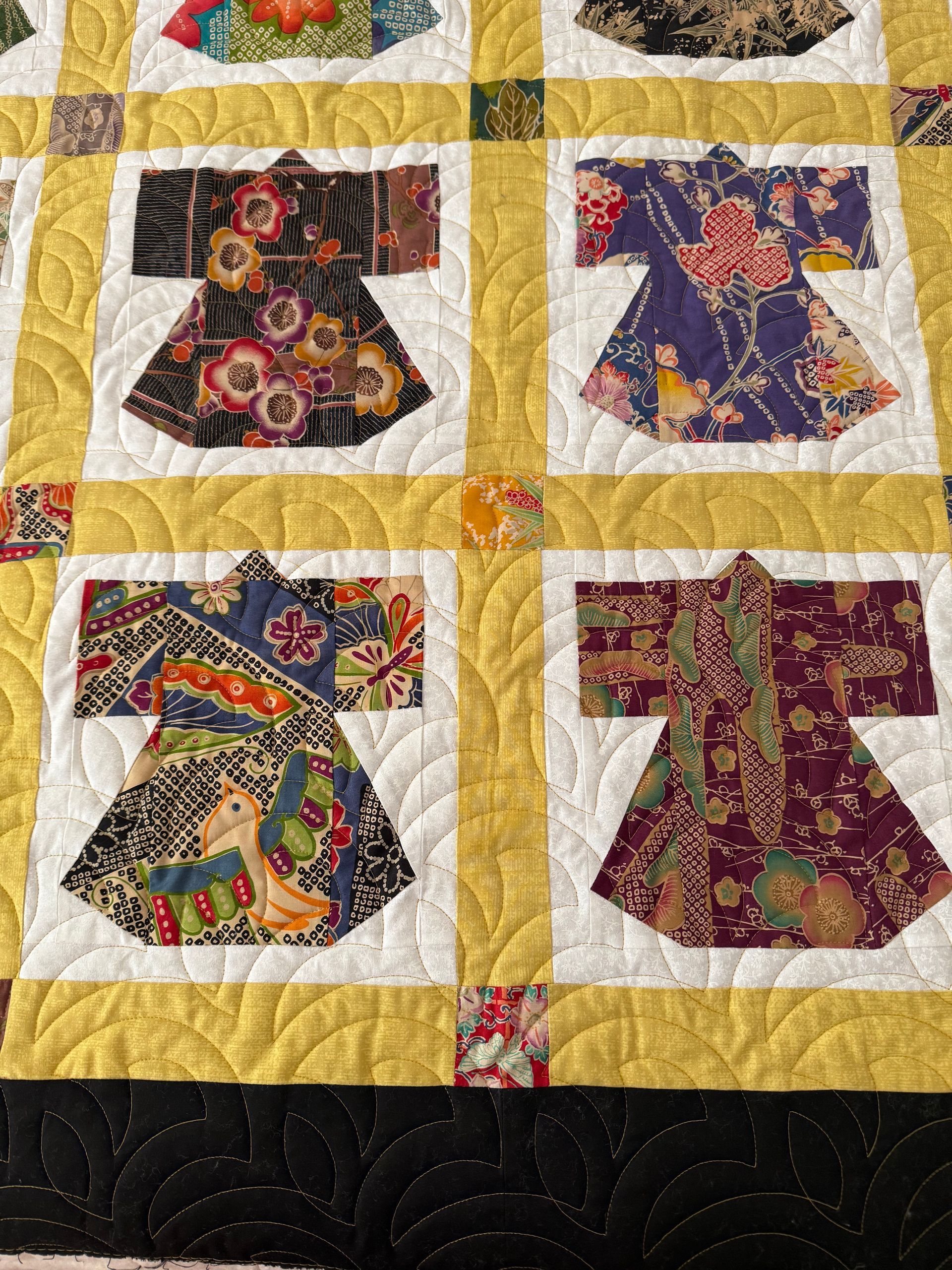Quilt with fabric kimono blocks; gold and white squares; black scalloped border — Morning Star Quilting in Bateau Bay, NSW