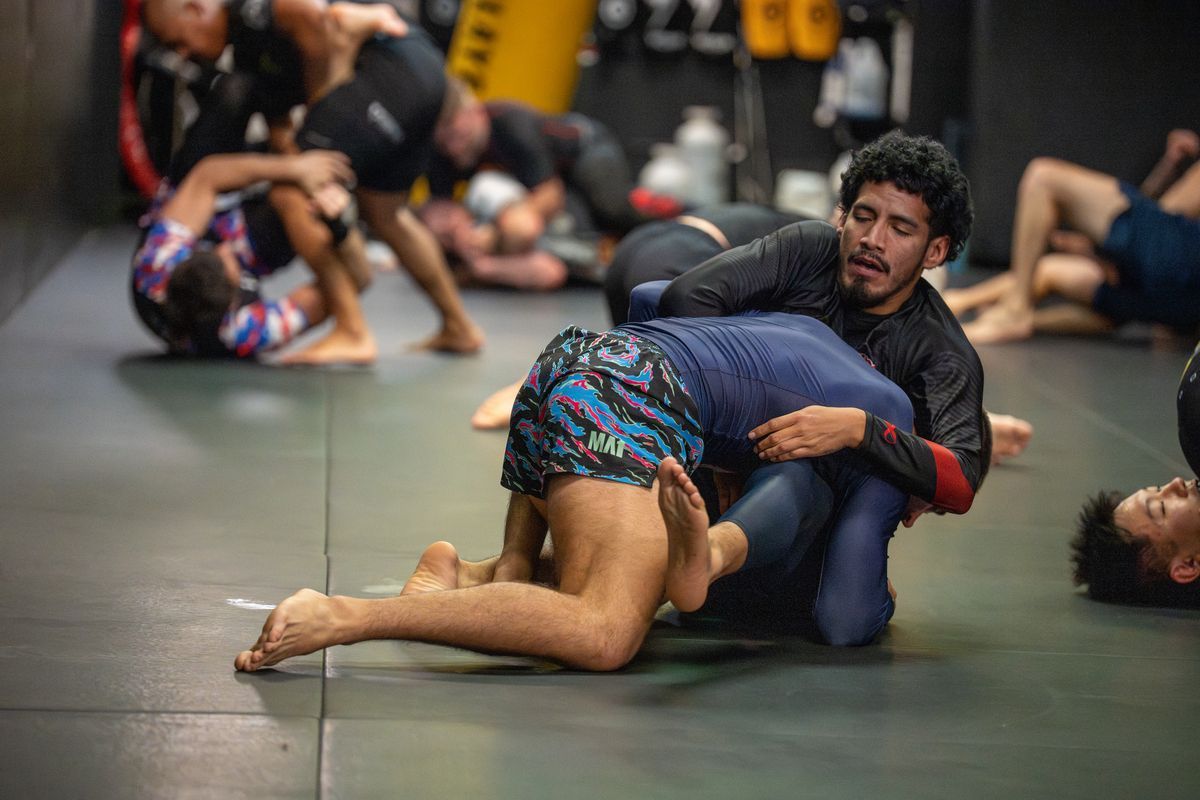 Adults drilling no-gi Brazilian Jiu-Jitsu at 10th Planet Orlando Jiu Jitsu in Altamonte Springs, FL 