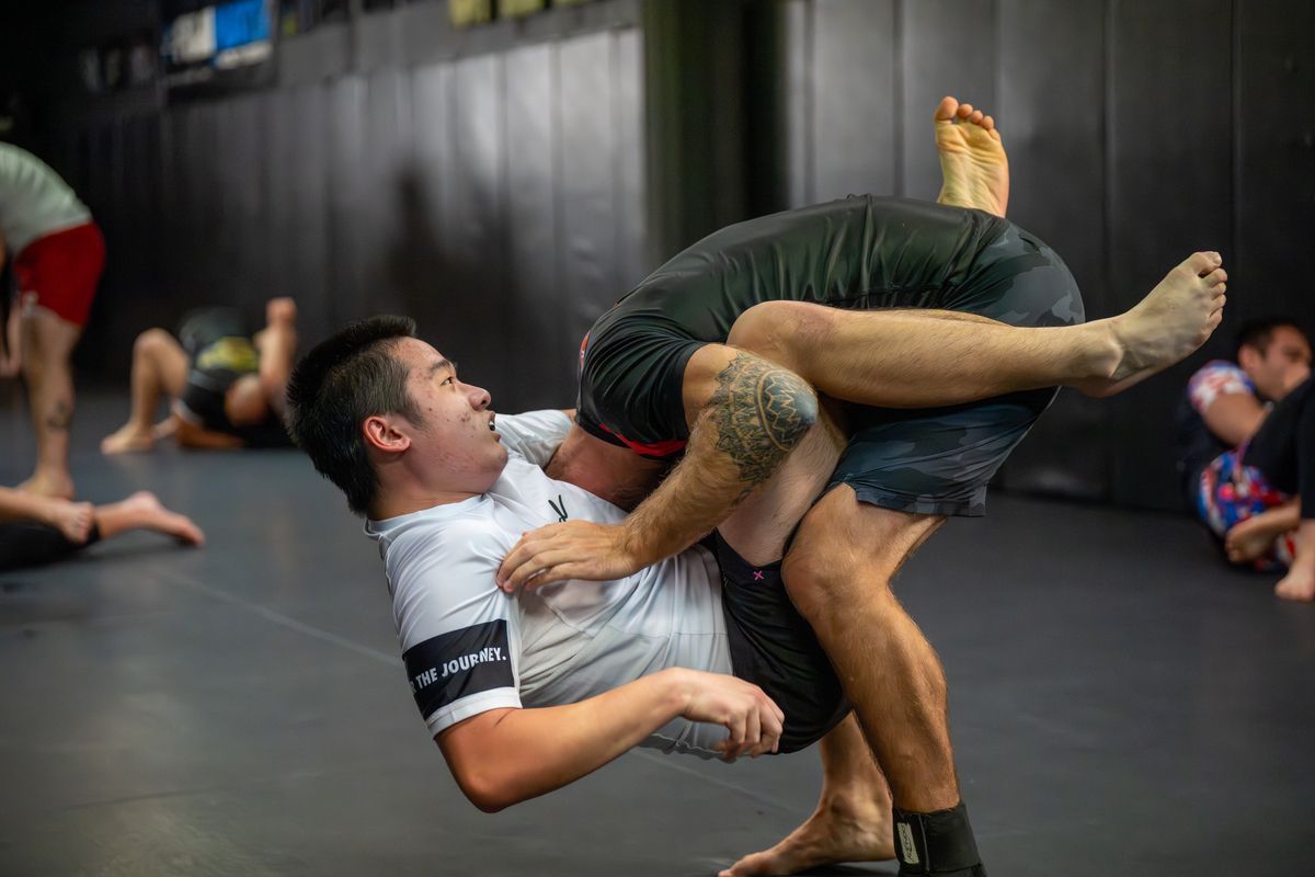 Adult students drilling no-gi grappling at 10th Planet Orlando Jiu Jitsu in Altamonte Springs, FL.