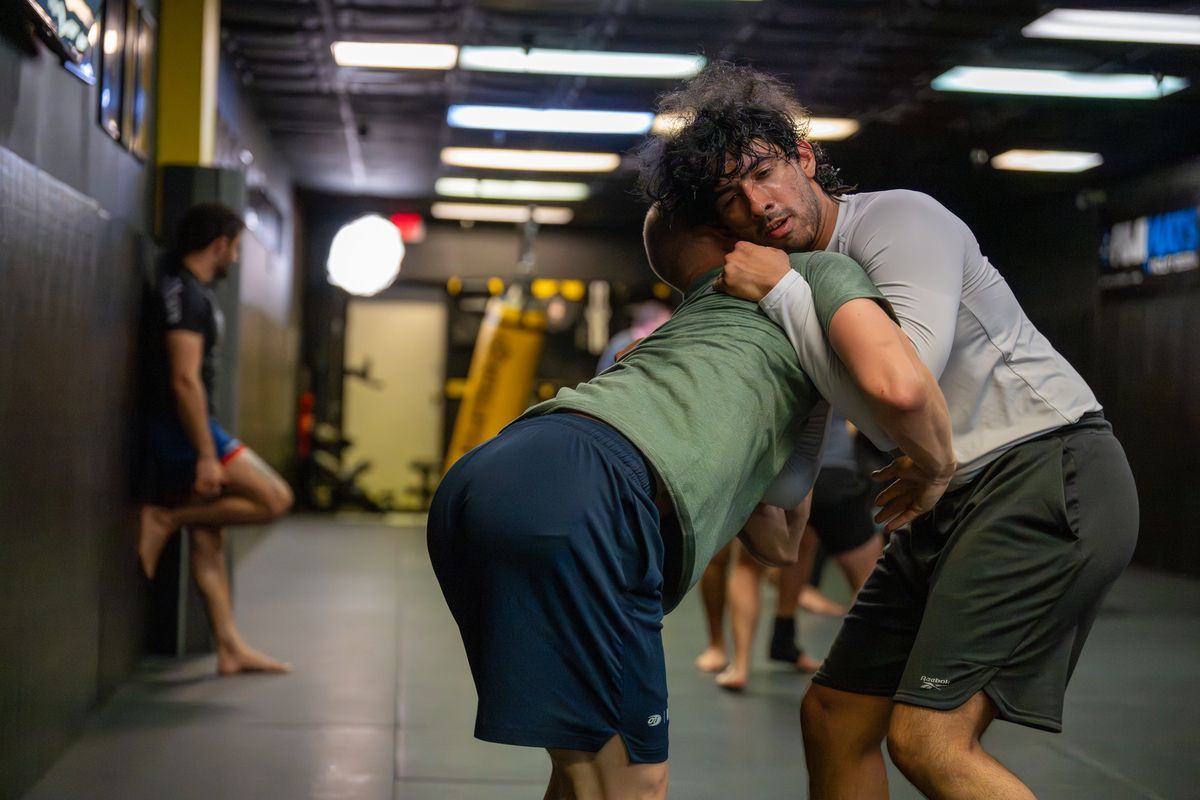 Adults drilling grappling technique at 10th Planet Orlando Jiu Jitsu in Altamonte Springs, FL.