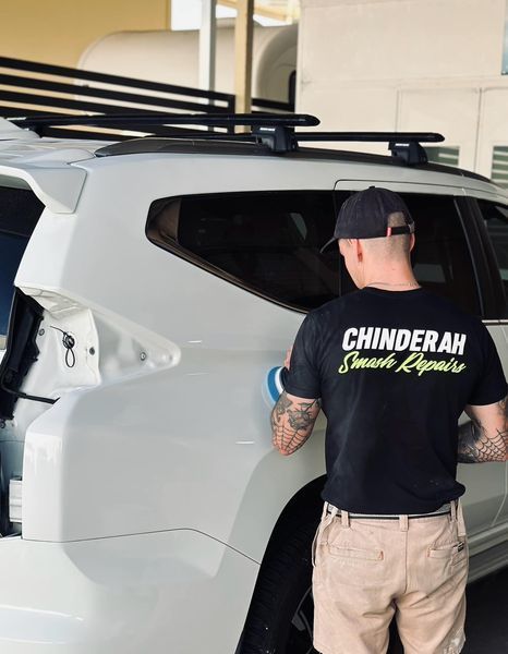 A Man Cleaning A White Car — Chinderah Smash Repairs in Chinderah, NSW