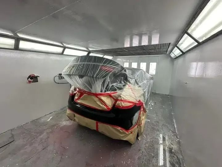 A Car Is Being Painted in A Paint Booth — Chinderah Smash Repairs in Chinderah, NSW