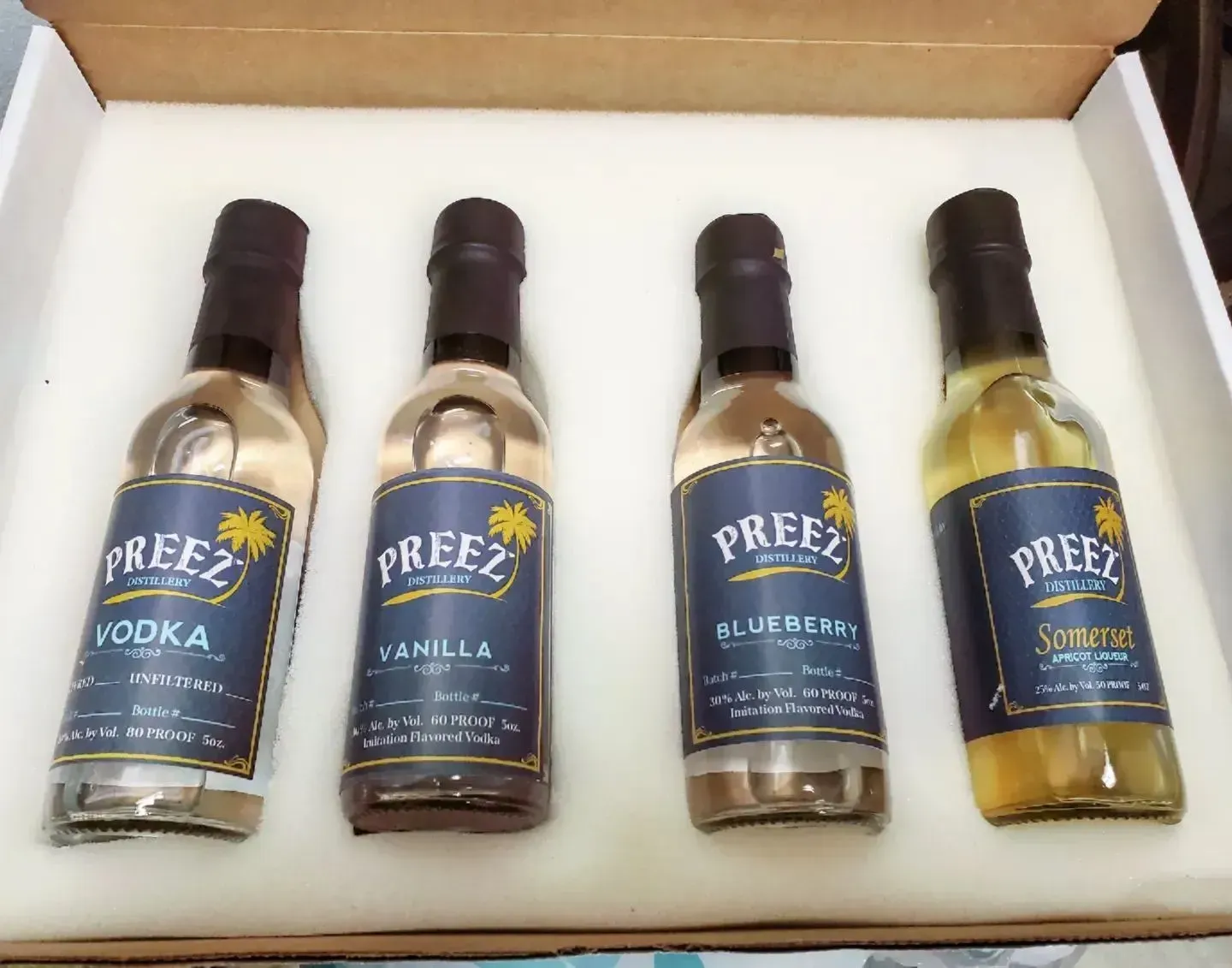 Four miniature bottles of 