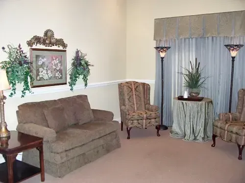 a living room with a couch and two chairs