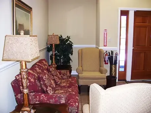 a living room with a fire extinguisher on the wall