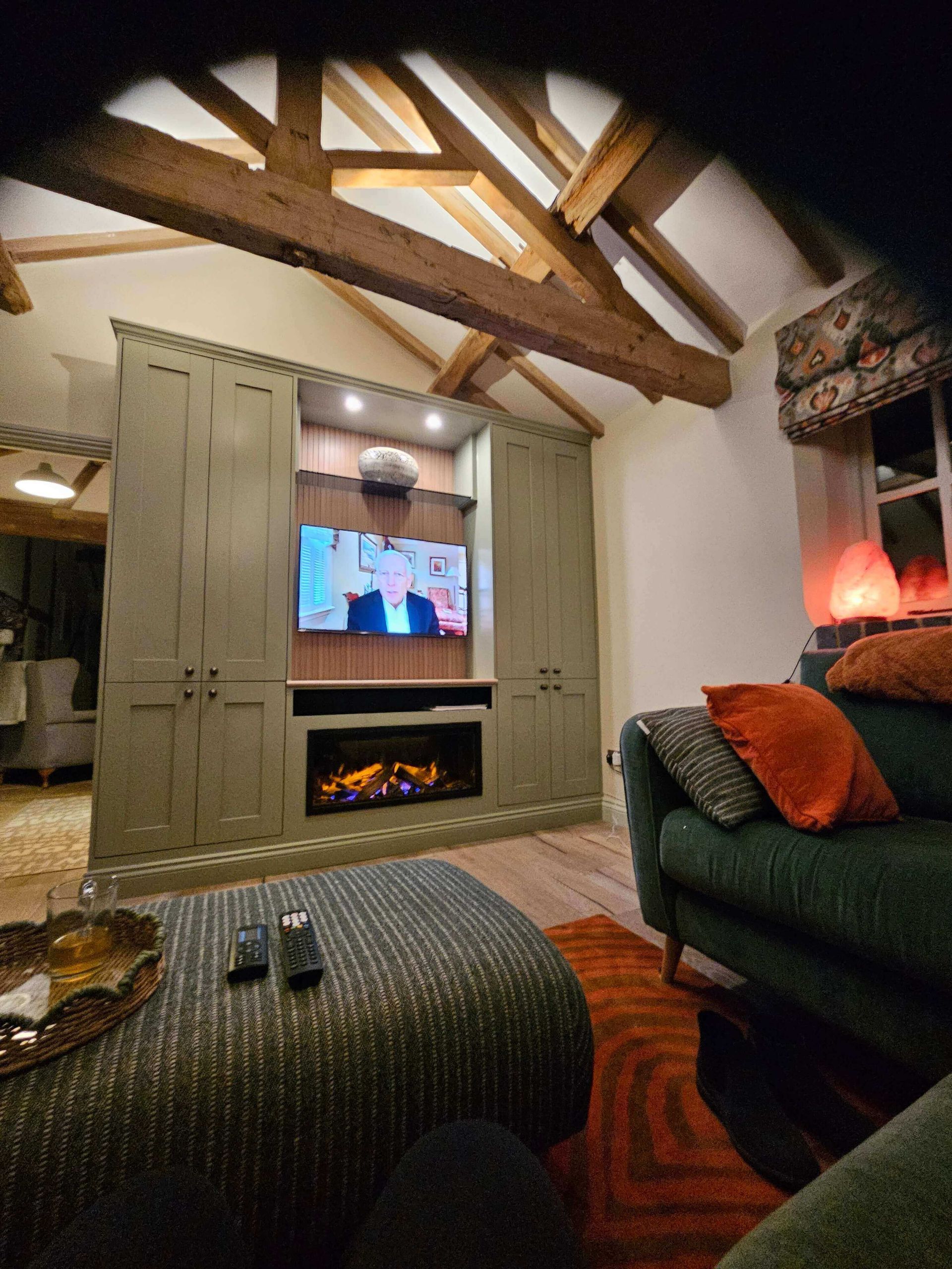 media wall with cupbaords and electric fire