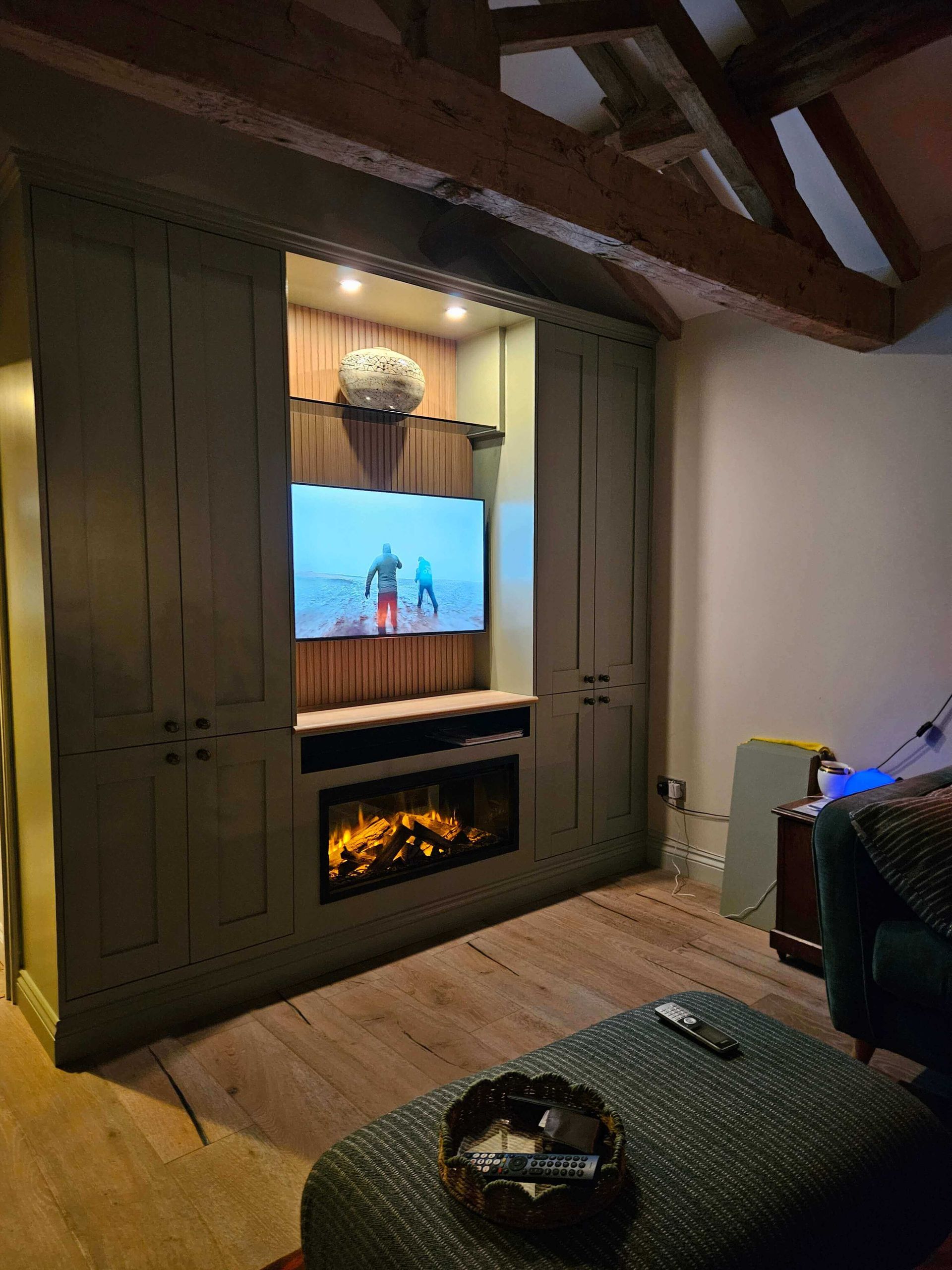 small electric fire in a media wall