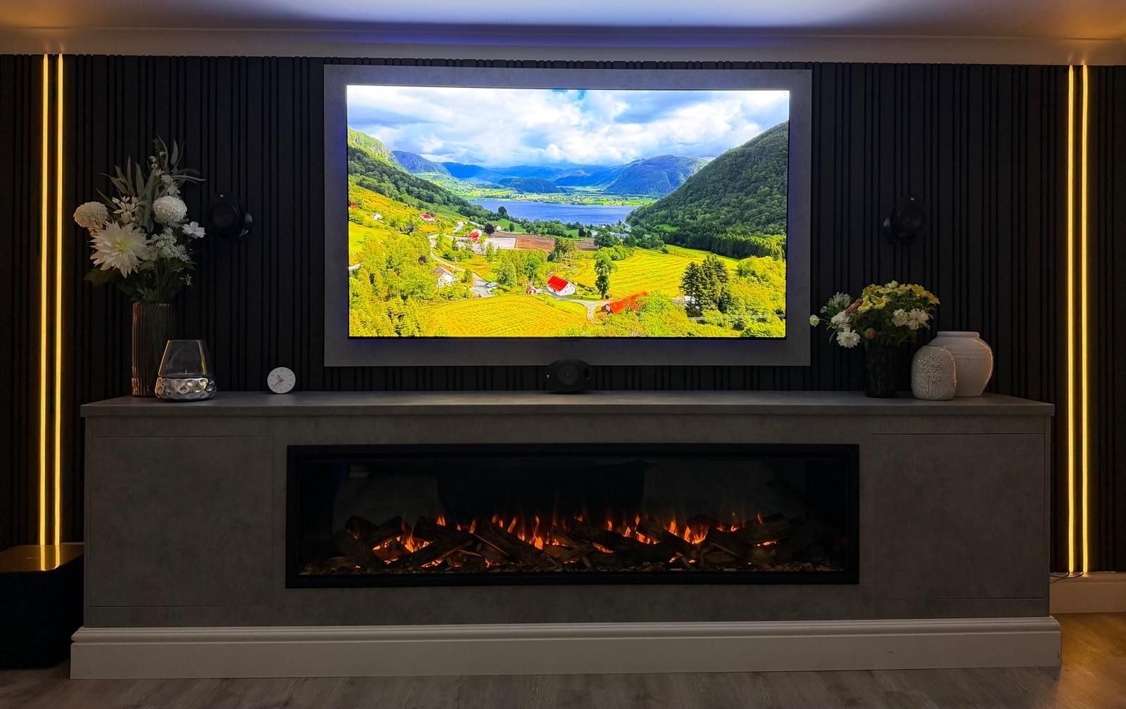 large electric fire in a media wall with front facing trim