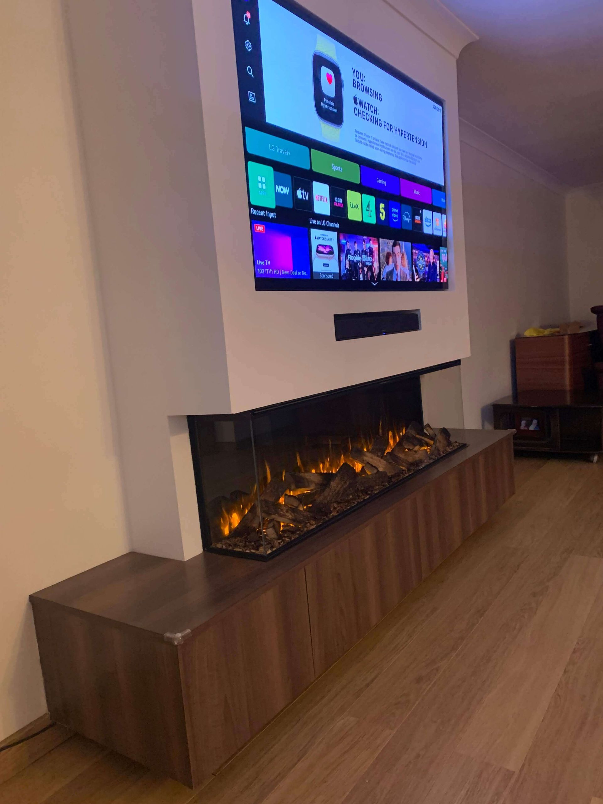 1600 electric fire in a media wall with sound bar