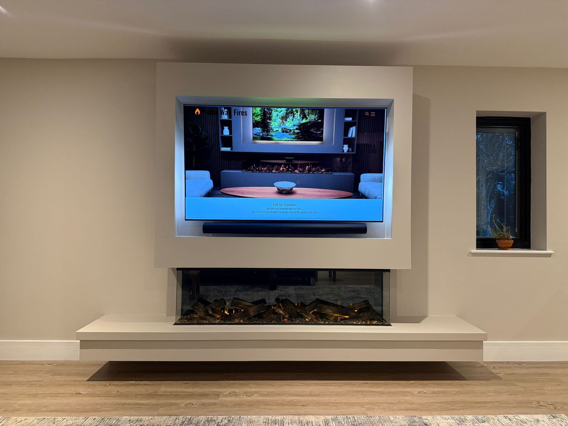 top of the range electric fire in media wall