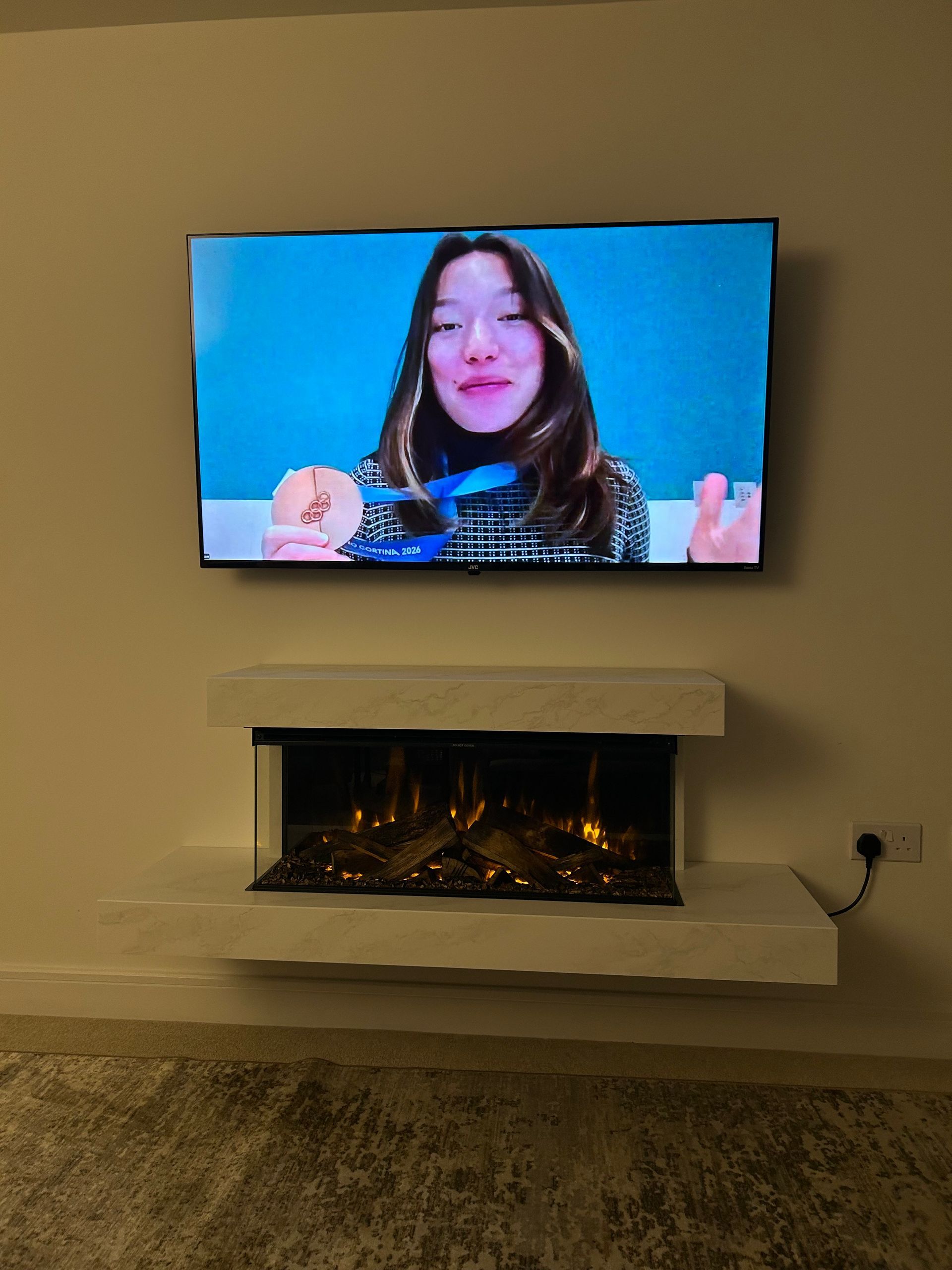 brockenhurst 870 electric fire suite under a 55 inch tv