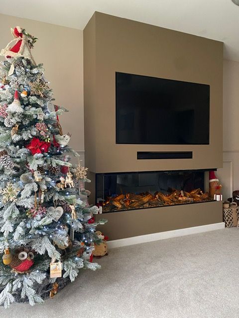 new forest 1600 electric fire in a media wall at christmas time
