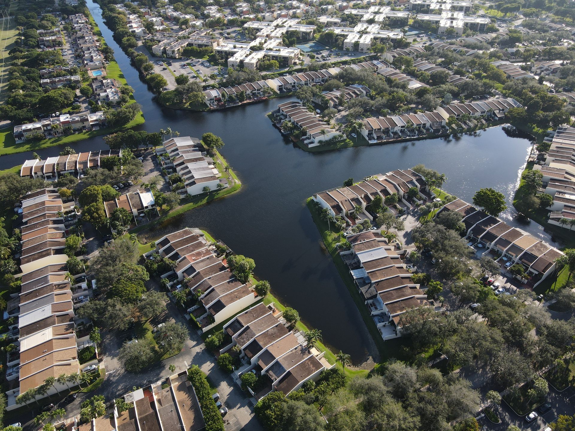 An aerial view of a residential area with a river running through it