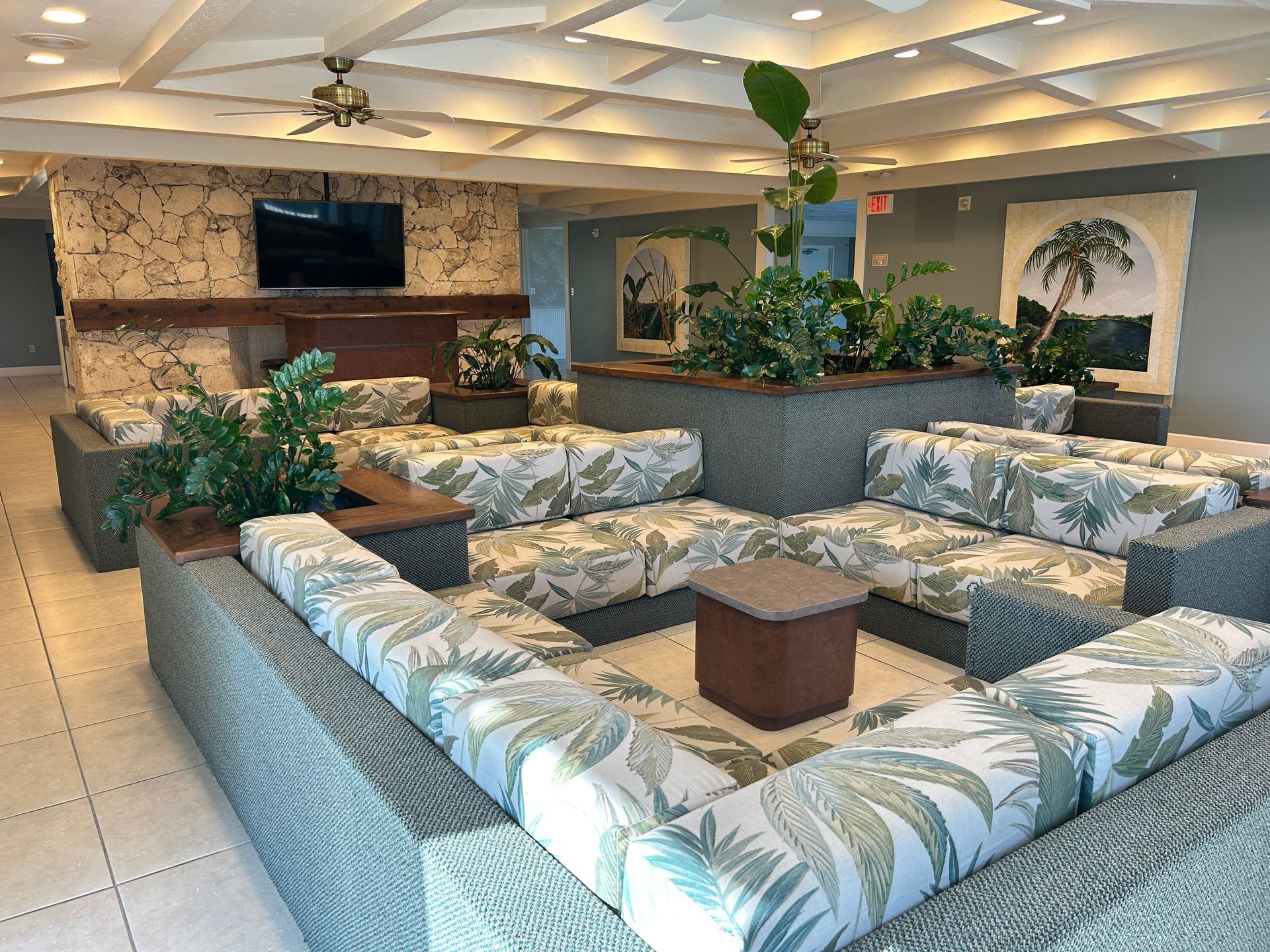 A living room with a lot of couches and a television