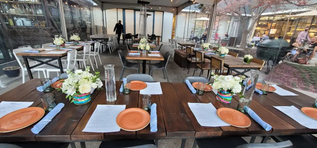 A restaurant with tables and chairs set up for a party.