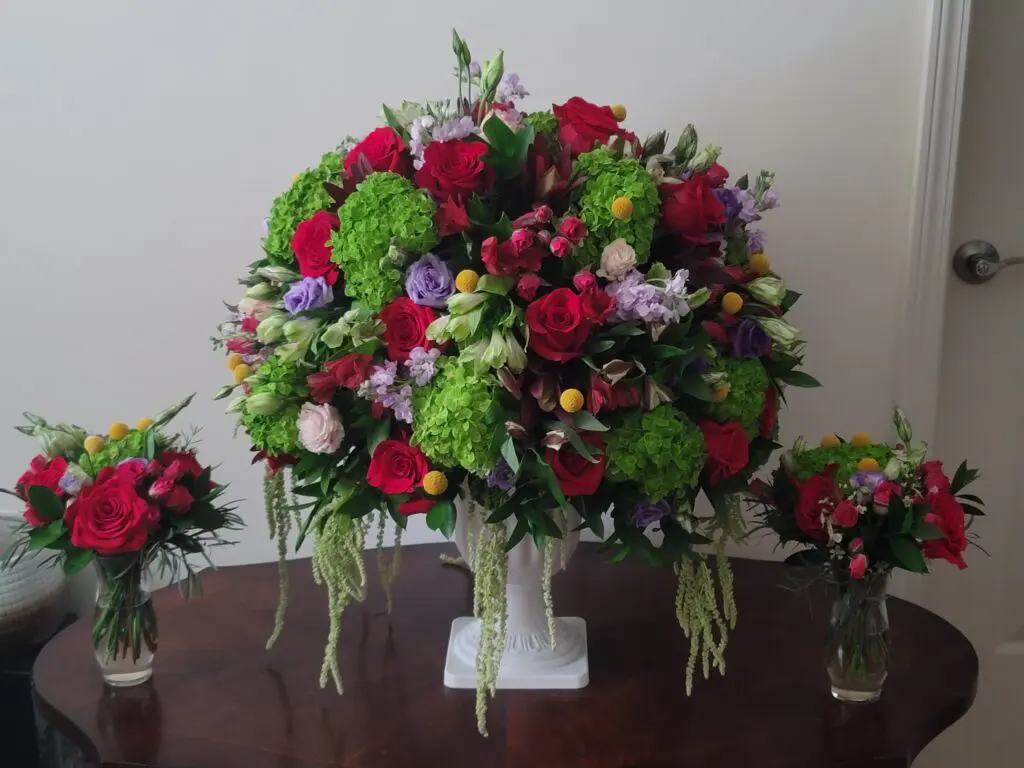 A table with a vase of flowers on it