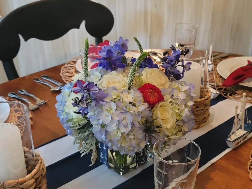 A table with a vase of flowers on it