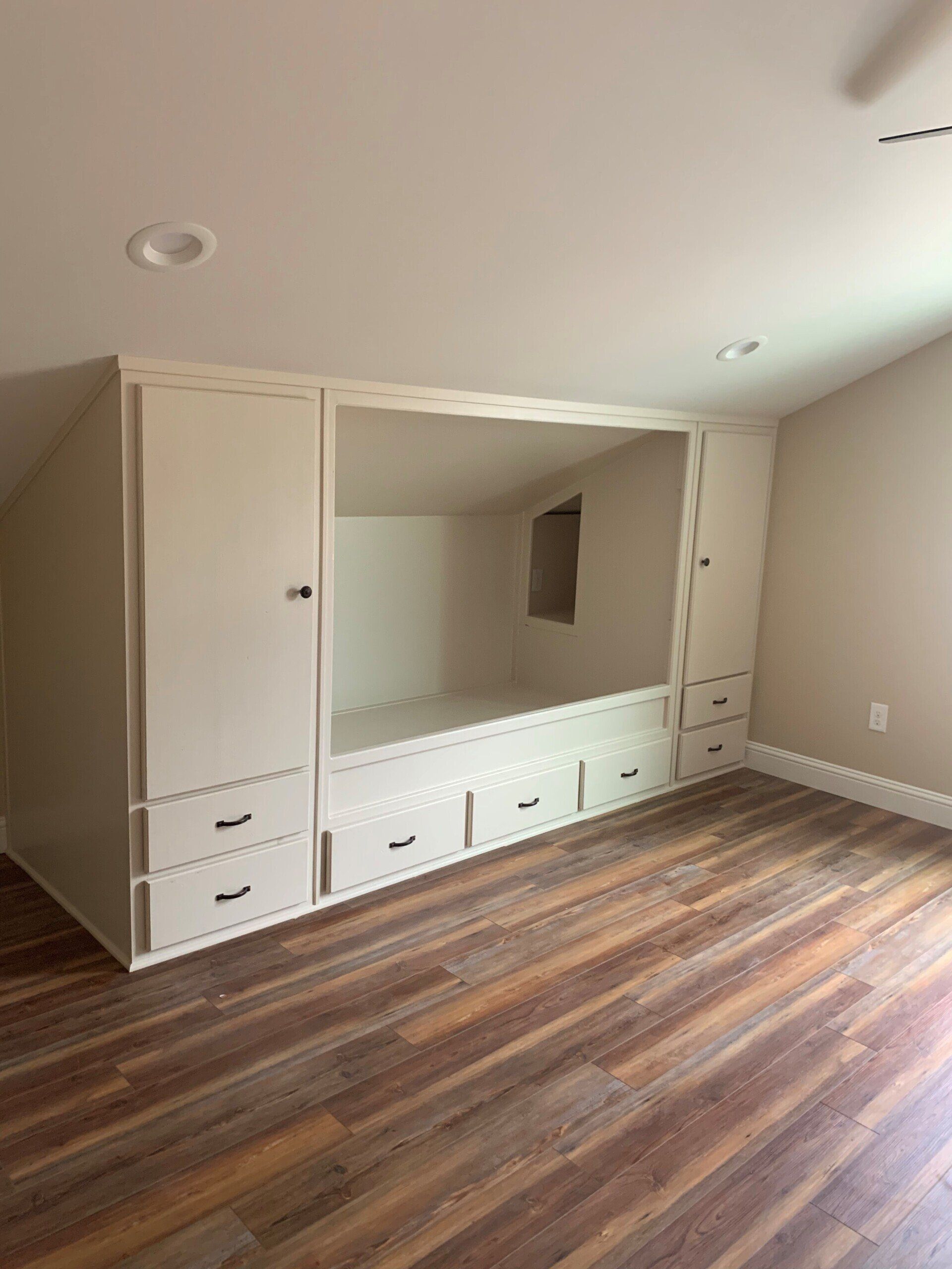 There is a bed in the corner of the room.