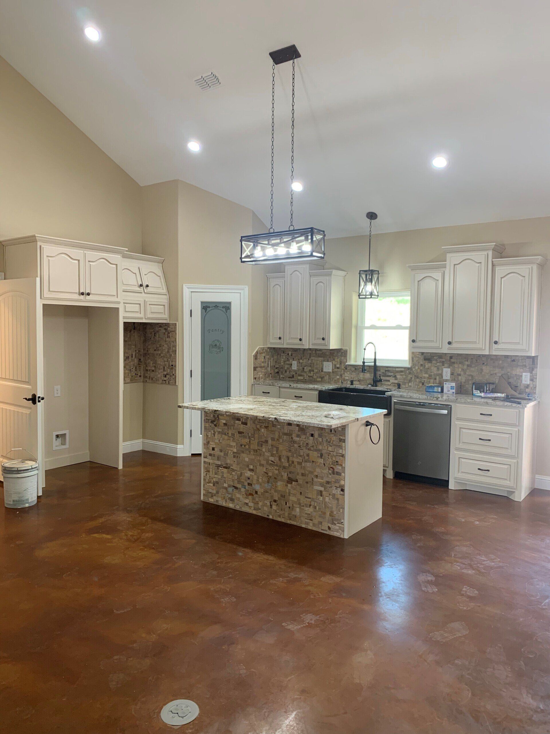 A kitchen with a large island in the middle of the room.