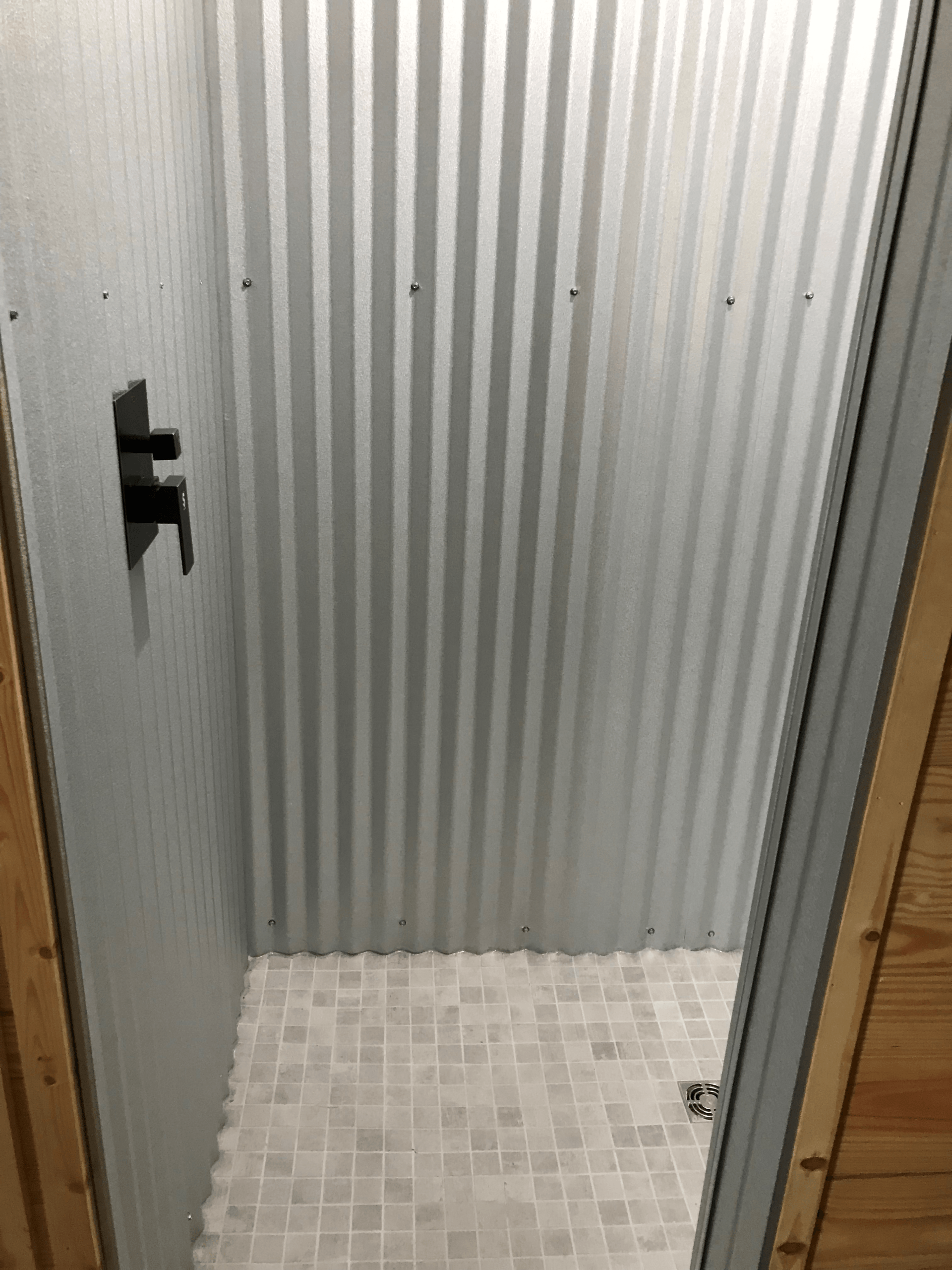 a shower inside of a metal building