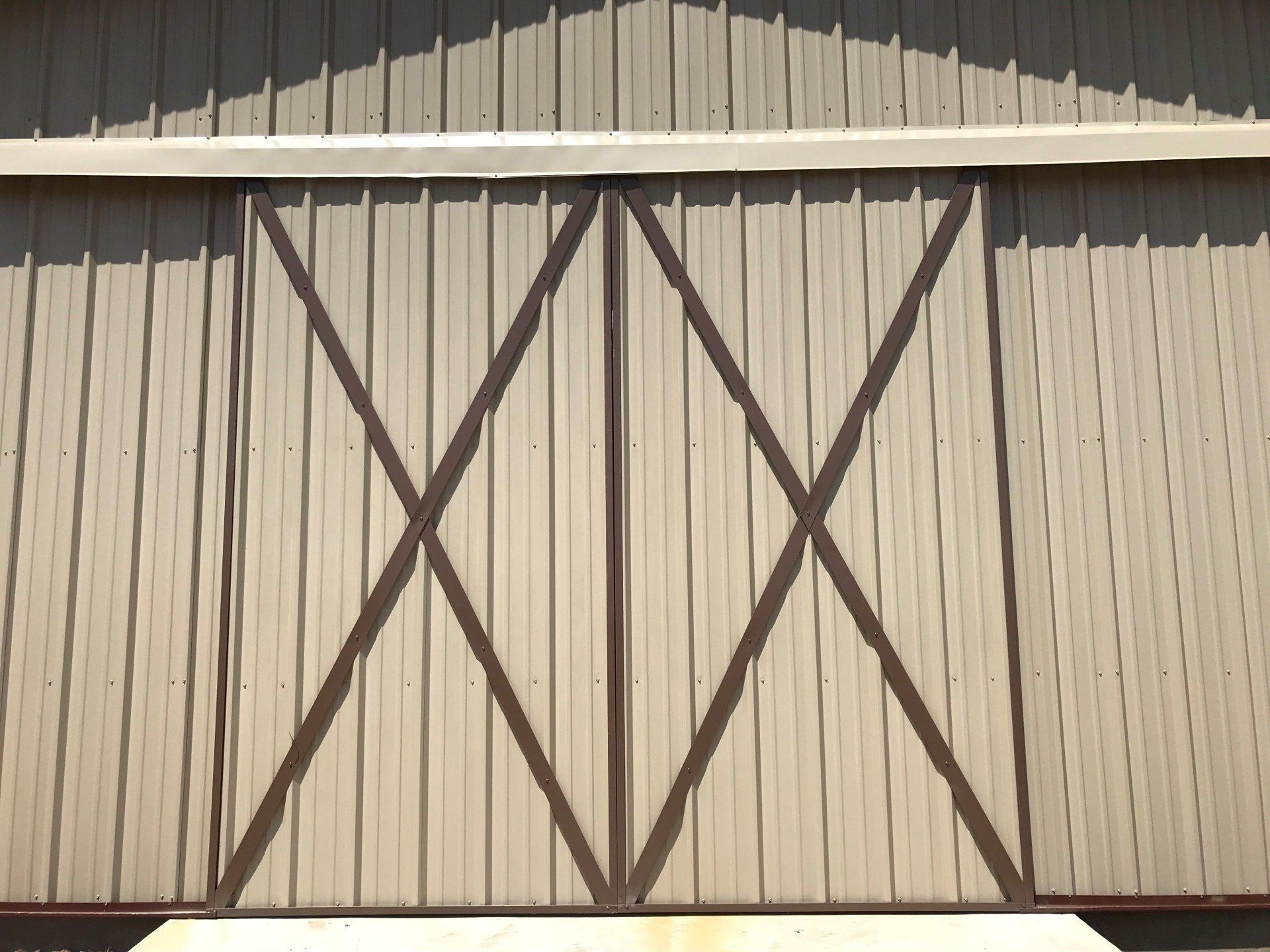 A barn door with a cross on it