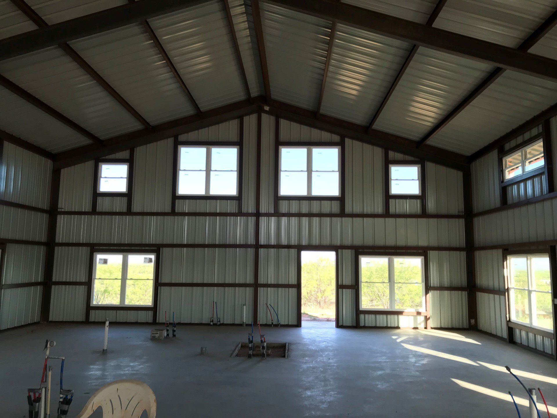 A large metal building with a lot of windows