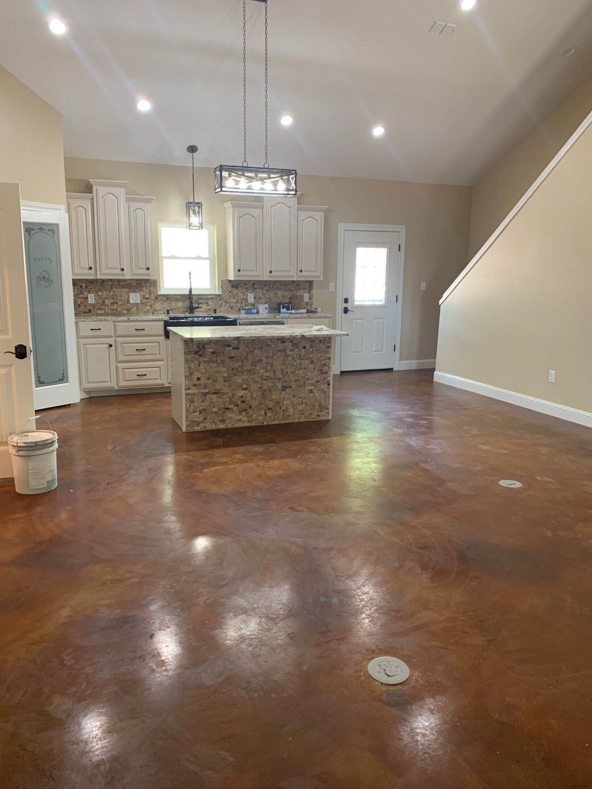 A kitchen with a large island in the middle of the room.