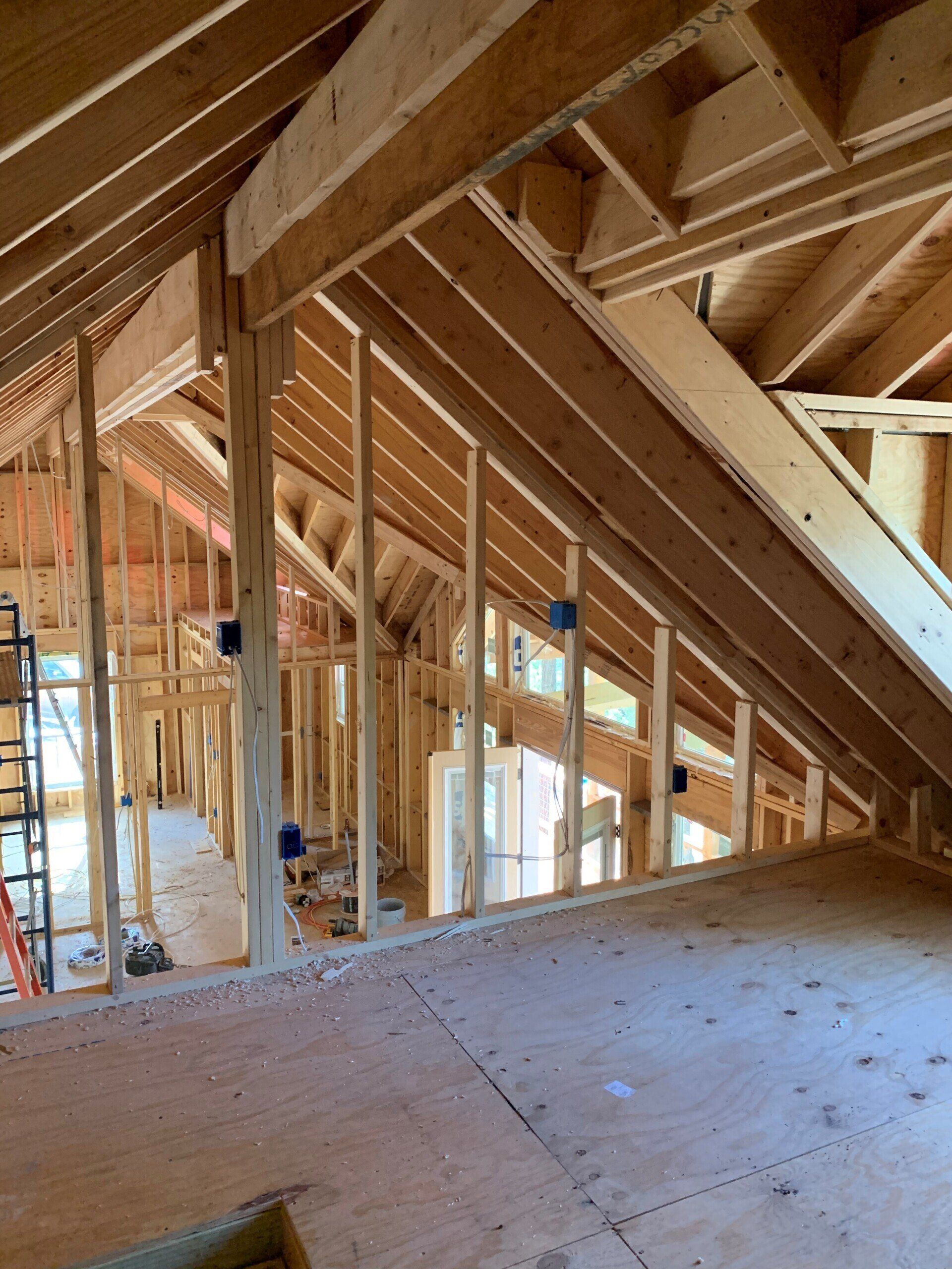 A house is being built with a lot of wooden beams.