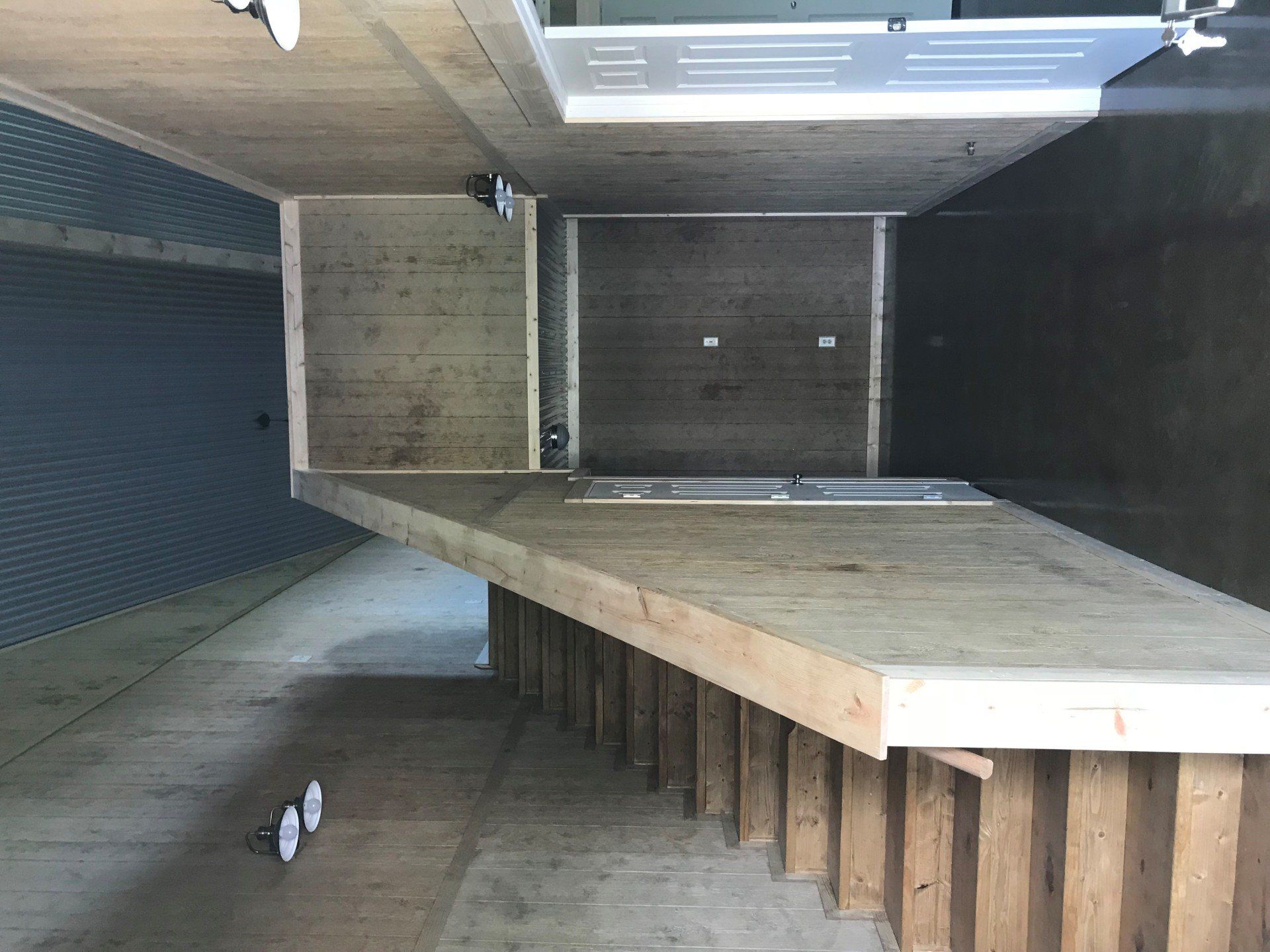 A wooden table is sitting in the middle of a room.