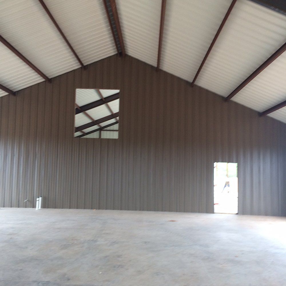 A large empty room with a window in the ceiling