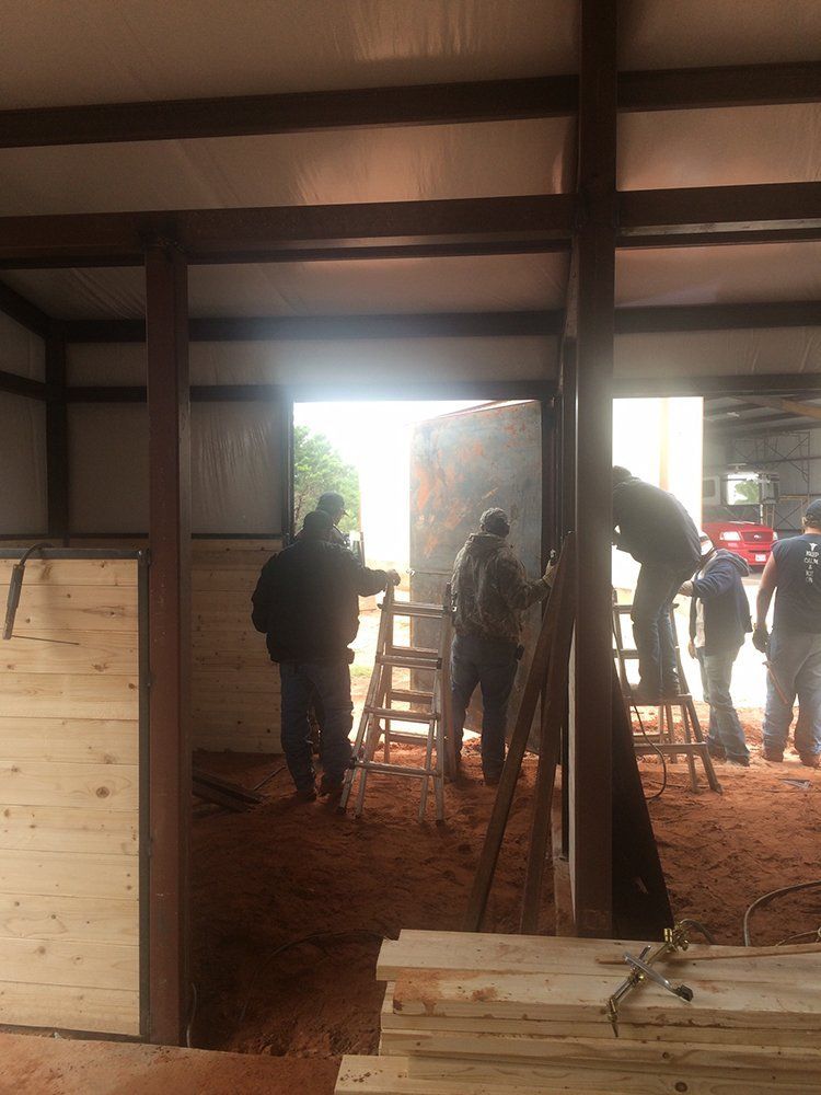 A group of people are working on a building.