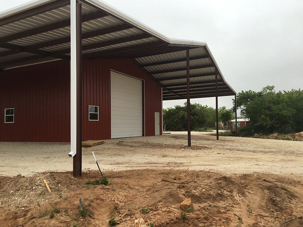 A large red building with a white garage door