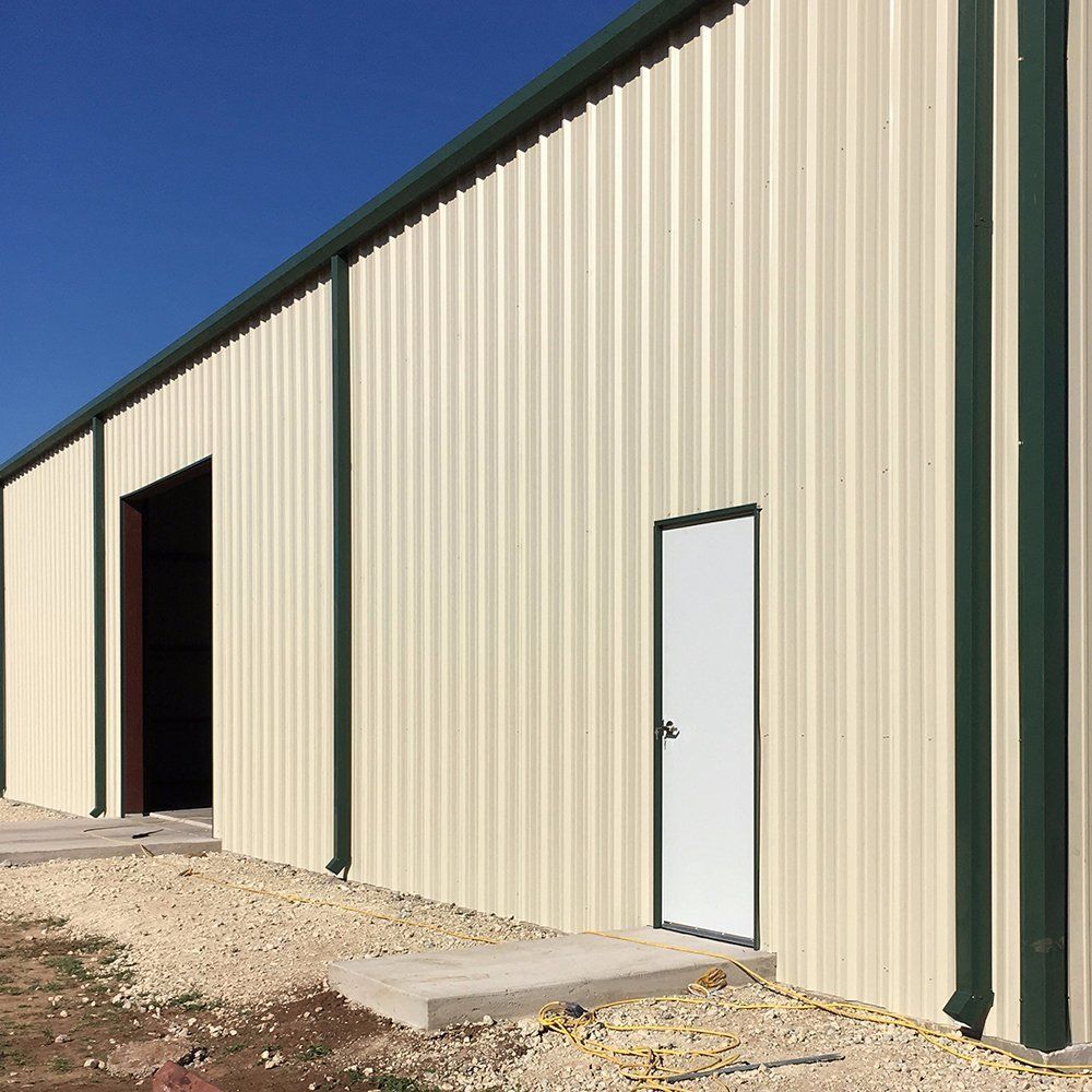 A building with a white door and green trim