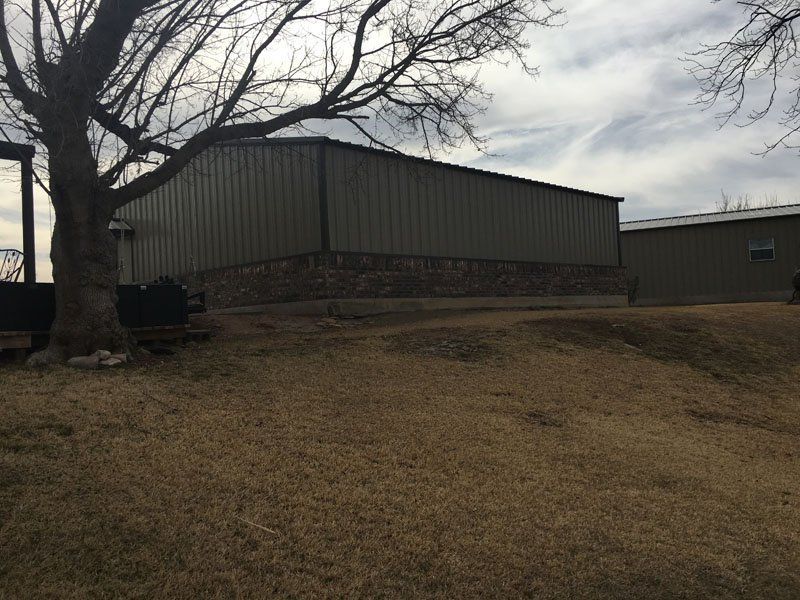A large building with a tree in front of it